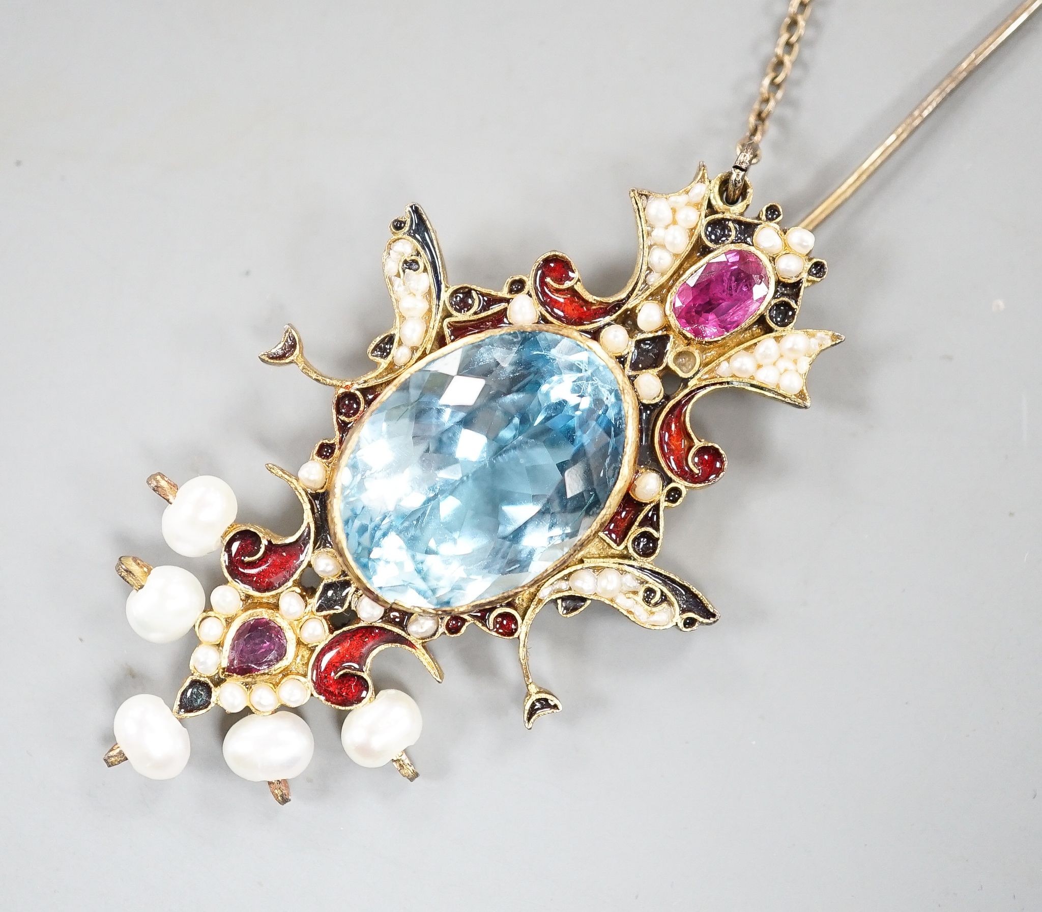 An Indian gilt metal, blue topaz, seed pearl, gem and enamel set hair ornament, 11.8cm.